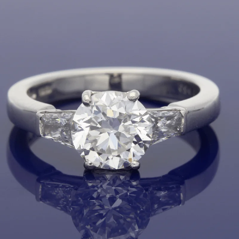 Platinum Solitaire Ring with Tapered Baguette Set Shoulders