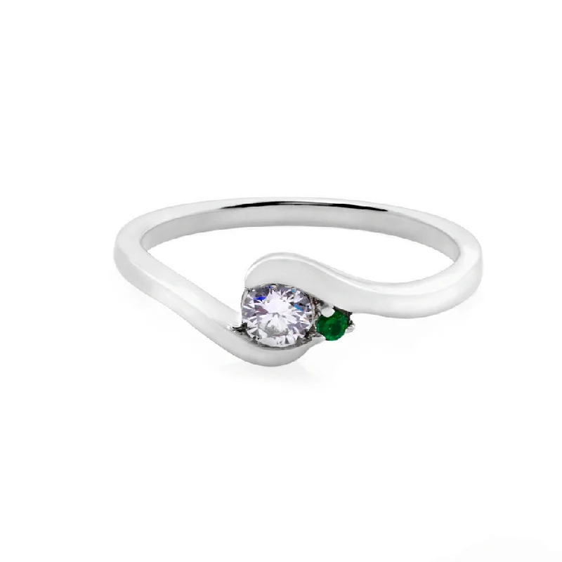 Round Brilliant Cut Diamond and Emerald Twist Ring in White Gold